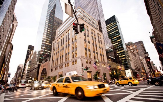 Yellow taxis rides on 5th Avenue in New York, USA.   Photo - Andrey Bayda